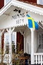 Charming Swedish Cottage with Flag and Historic Date