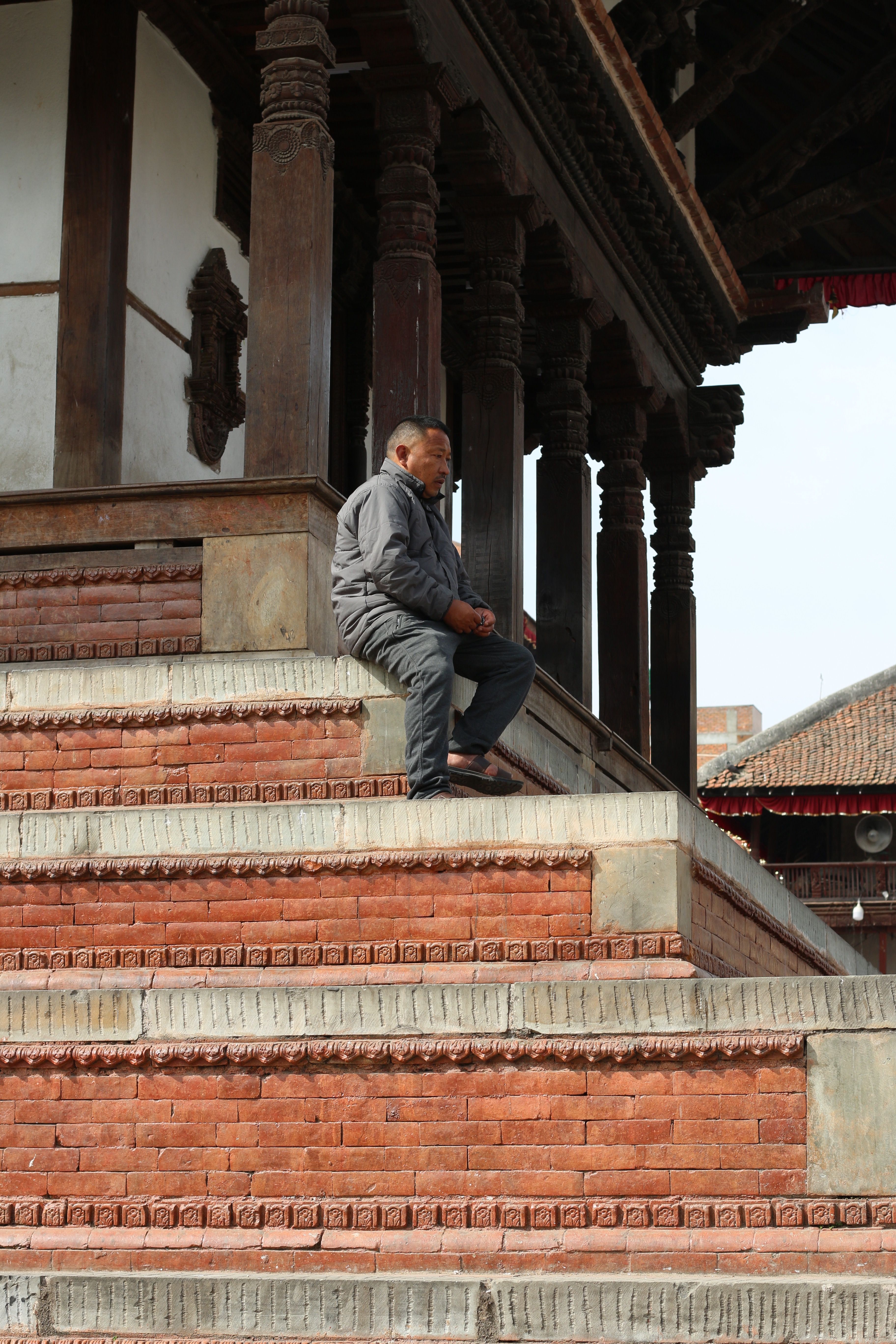 Contemplation at Kathmandu Temple Steps · Free Stock Photo