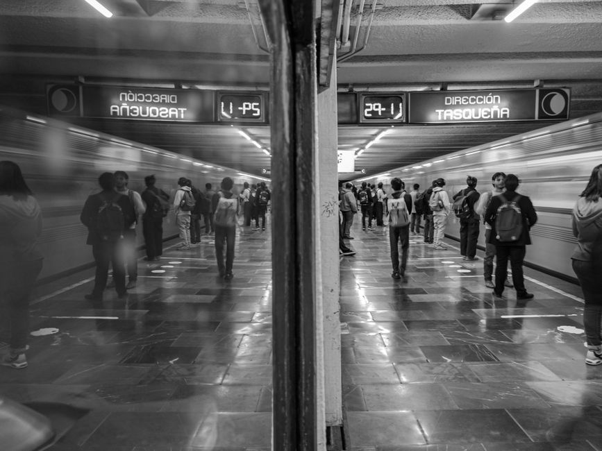 Interior of a Mexico City Metro train station, illustrating efficient and affordable public transportation.