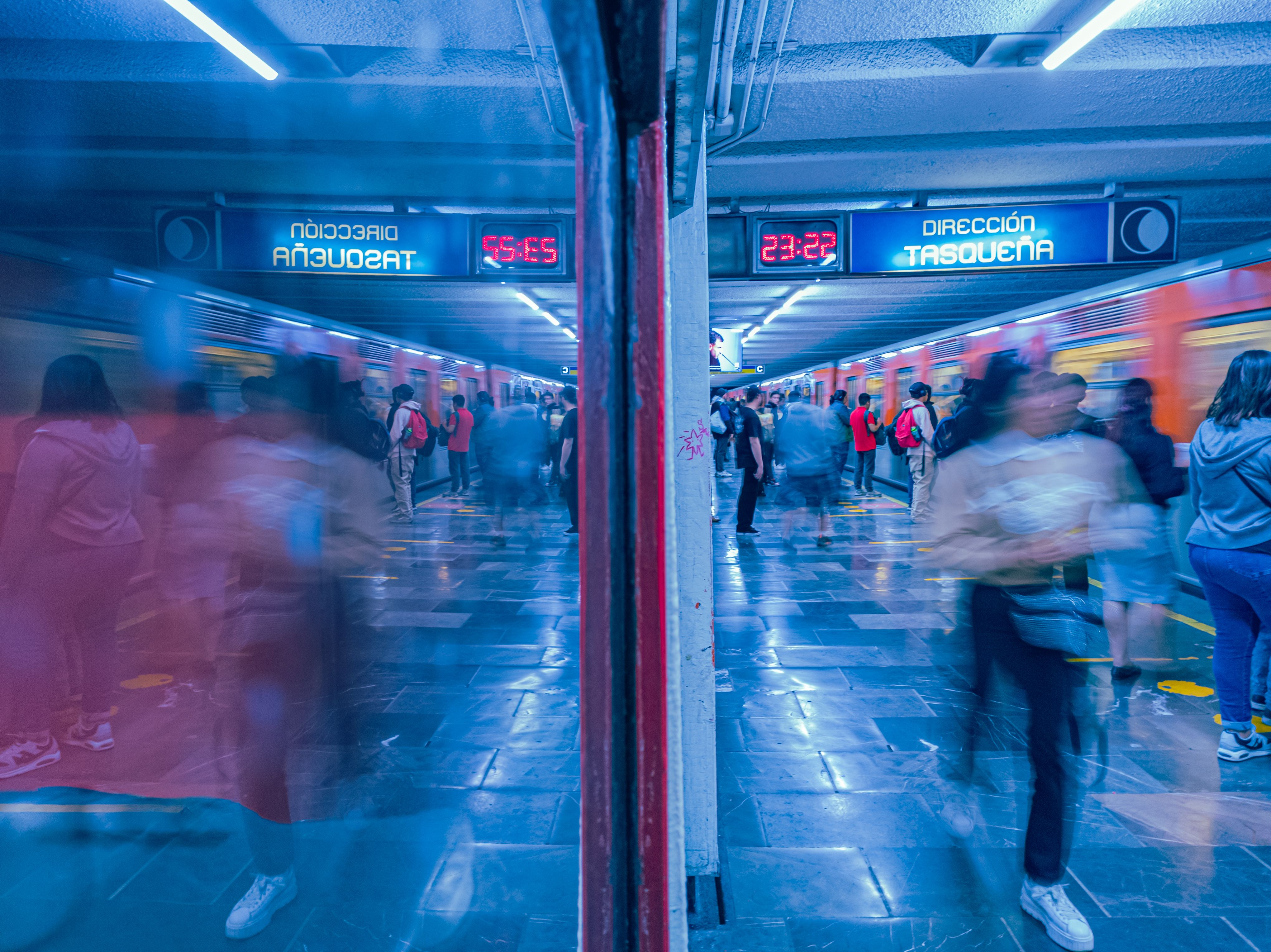 Motion blur in a bustling metro station in Ciudad de México, CDMX, showcasing vibrant city life.