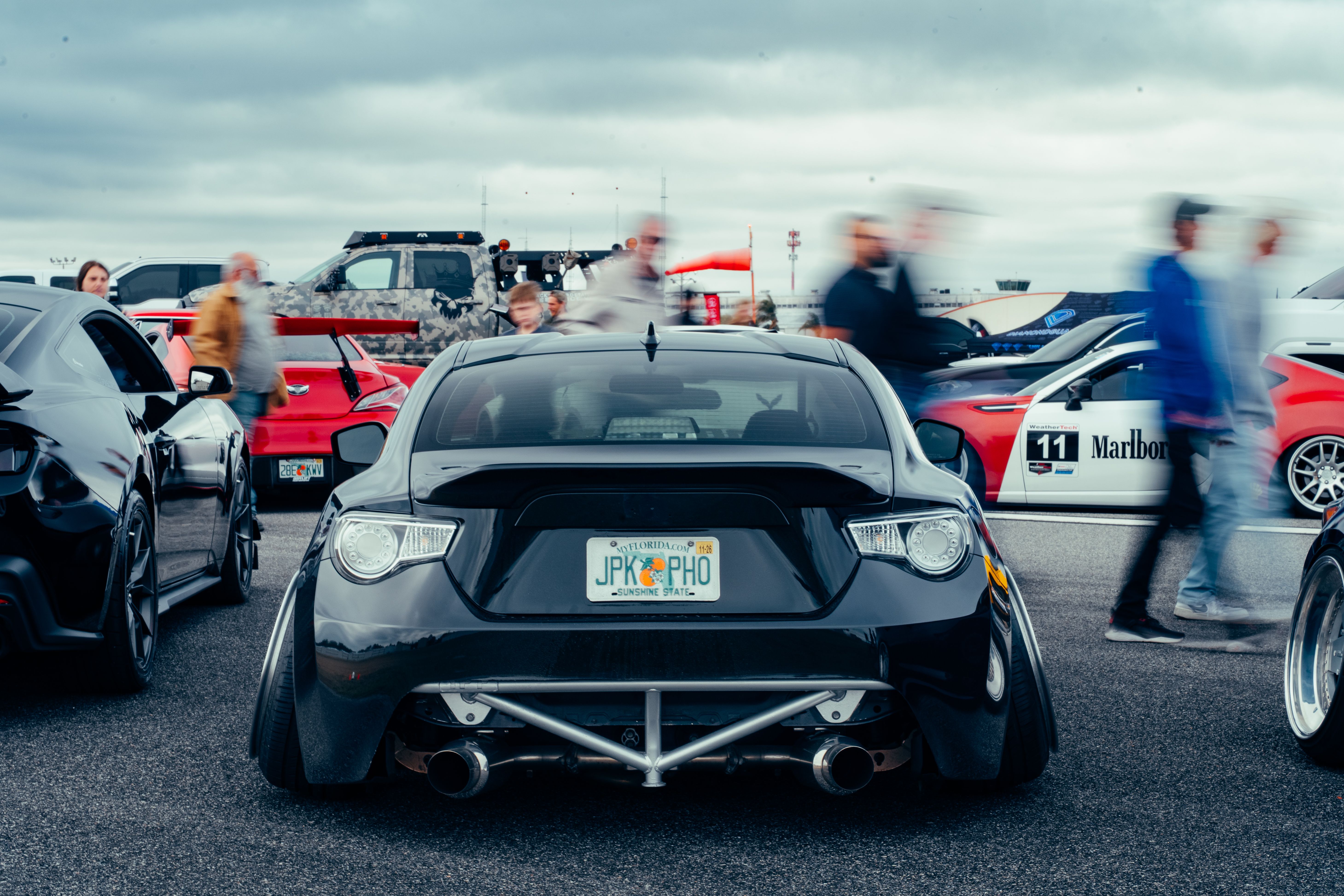 Dynamic Car Show Featuring Modified Vehicles