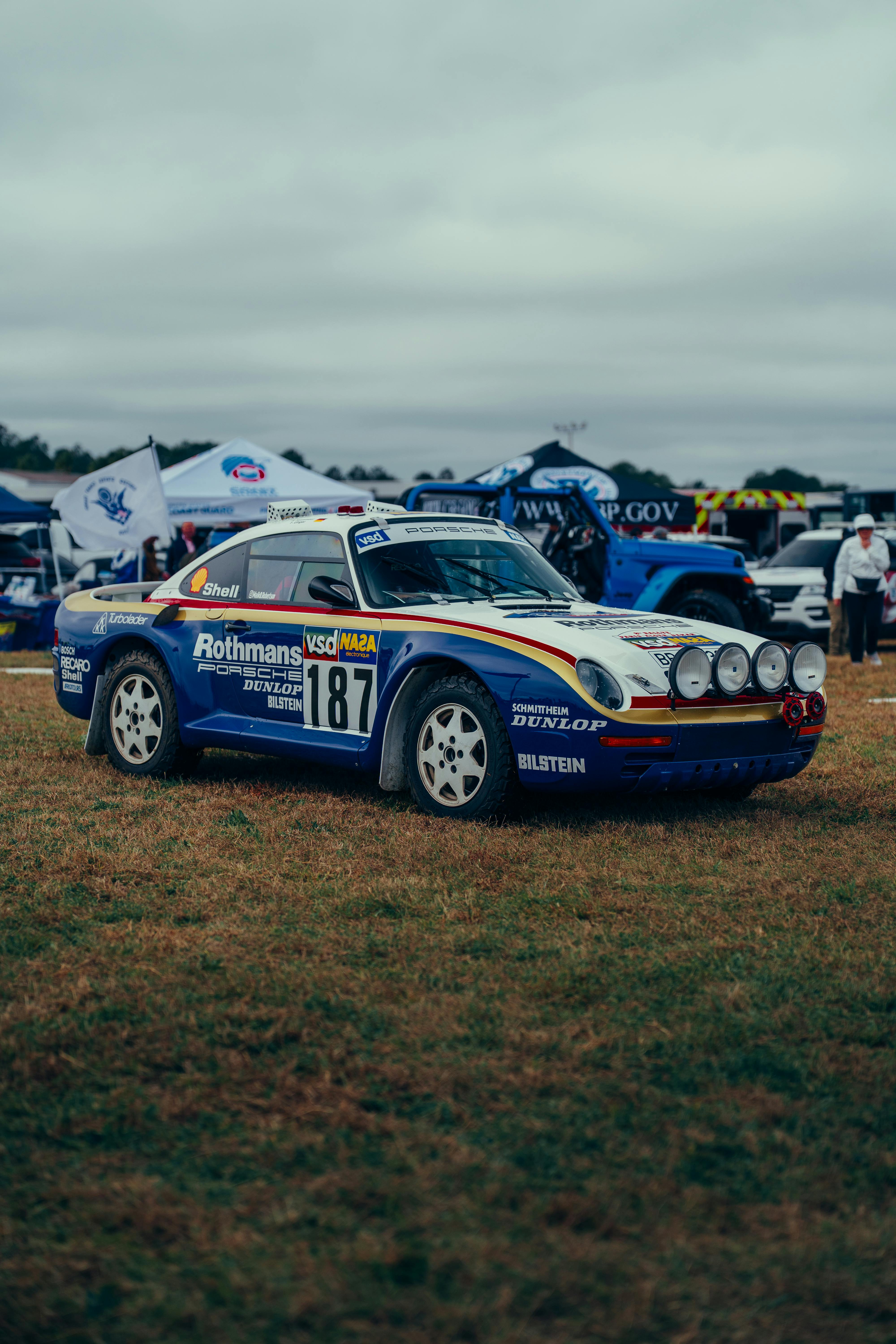 Free Vintage rally car at an outdoor car show, showcasing classic automotive design and racing history. Stock Photo