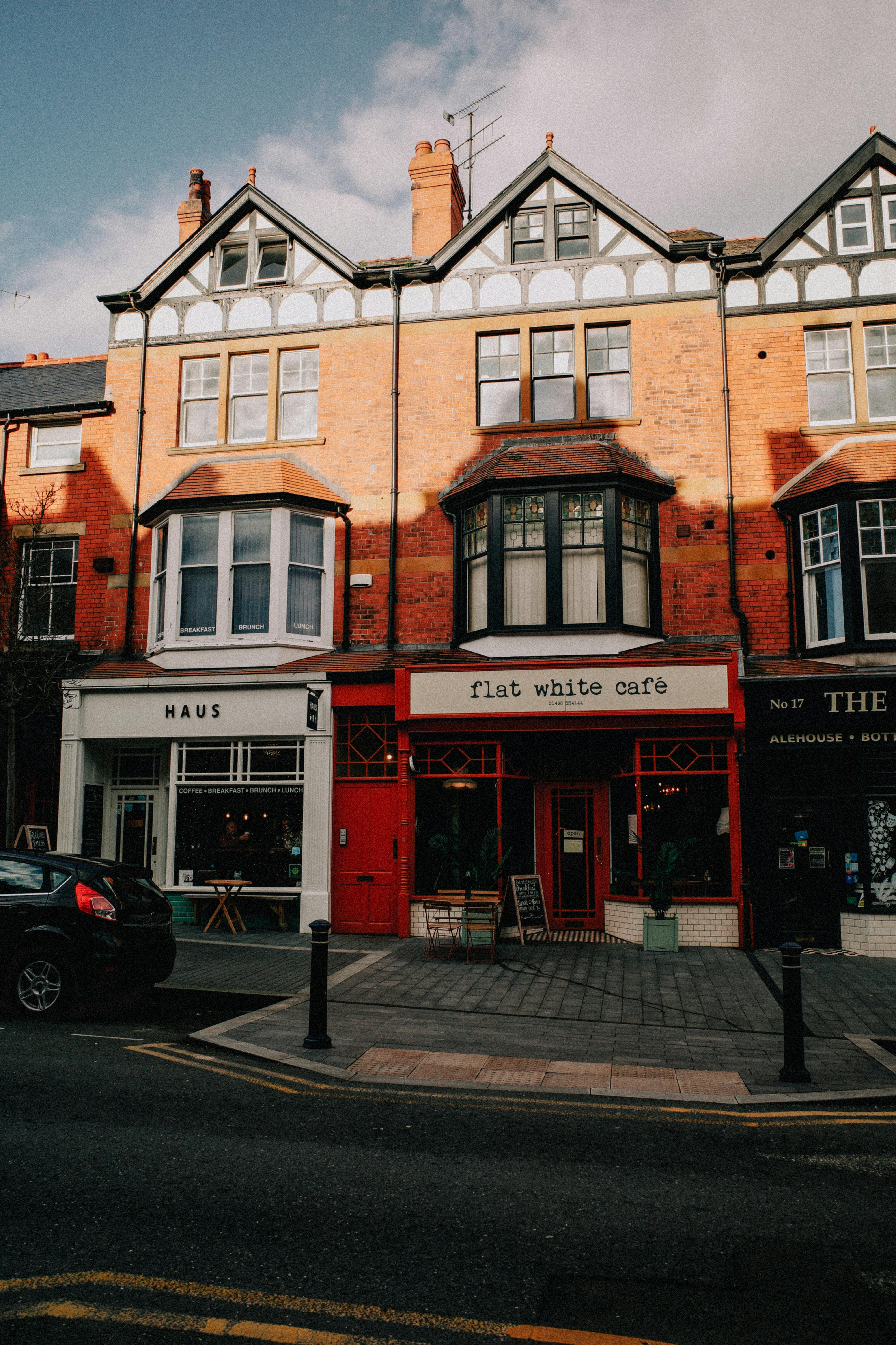 Picturesque street view of Colwyn Bay's vibrant cafes in North Wales.