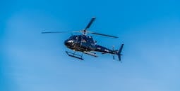 Helicopter Flying Against Clear Blue Sky