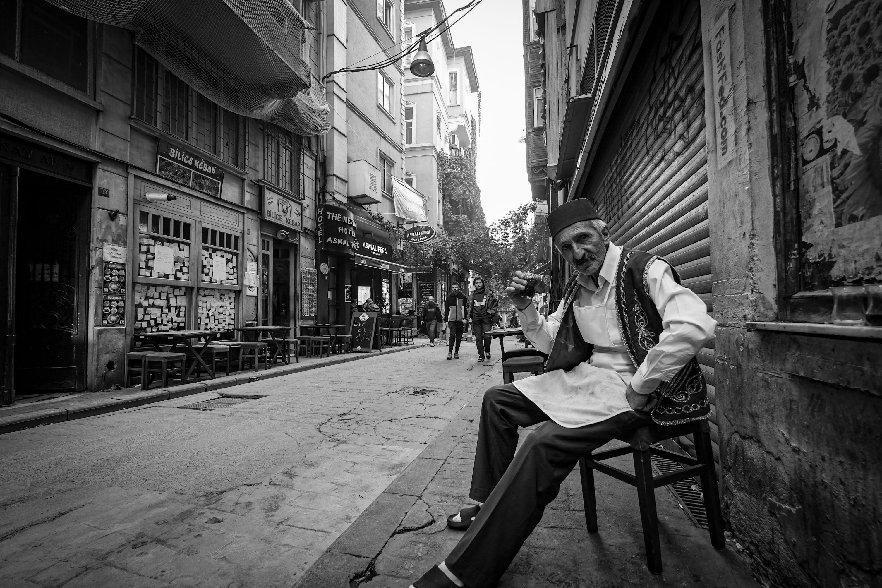 Elderly Man in Traditional Clothing on City Street · Free Stock Photo