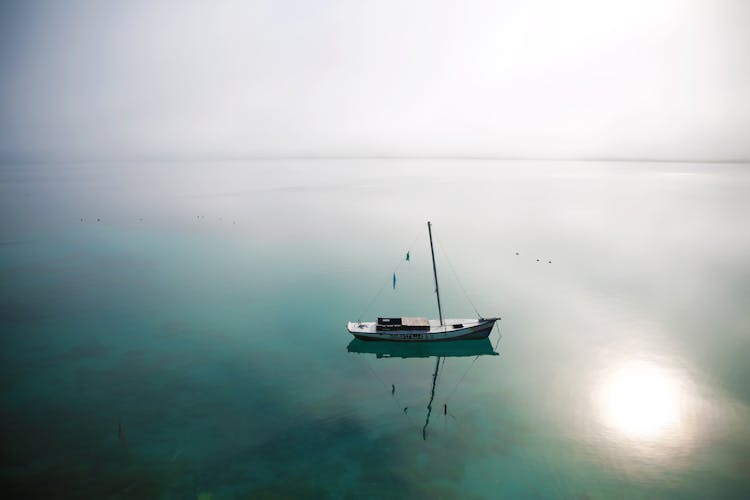 Sailboat On Placid Body Of Water