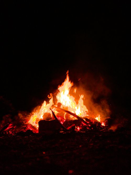 Free Captivating bonfire with vibrant flames illuminating the night, captured outdoors in India. Stock Photo