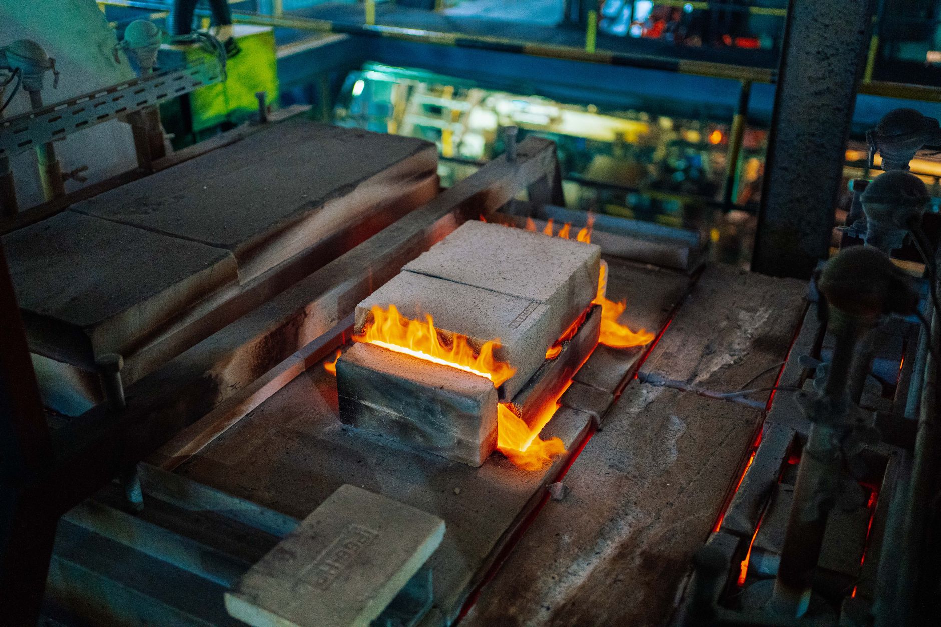 A vibrant and active glassmaking furnace in a factory located in Tanzania.