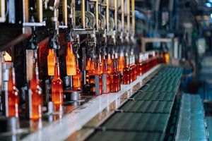 Molten glass being drawn in a factory. Photo by Keegan Checks on Pexels