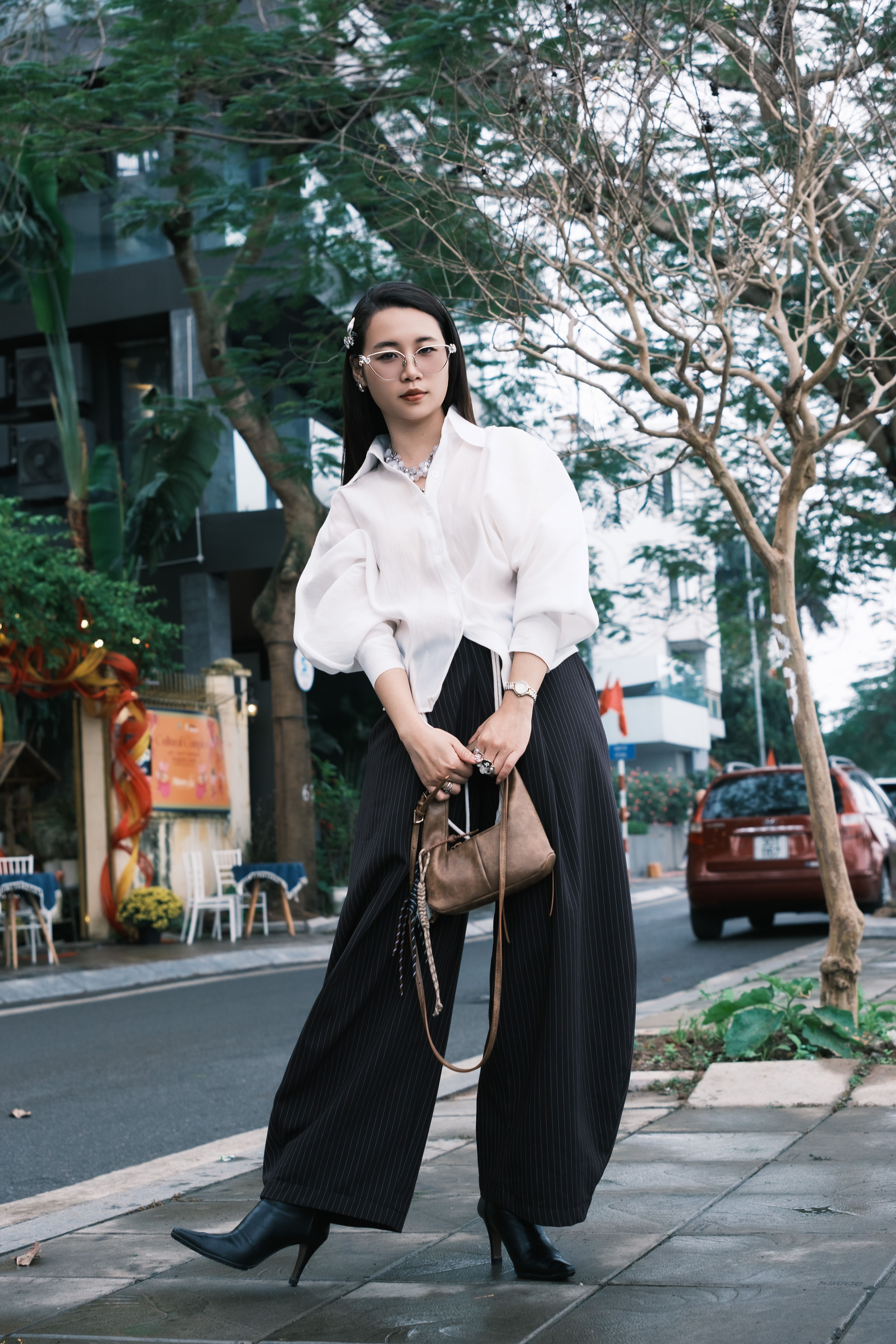 Stylish Woman Posing on a City Street · Free Stock Photo