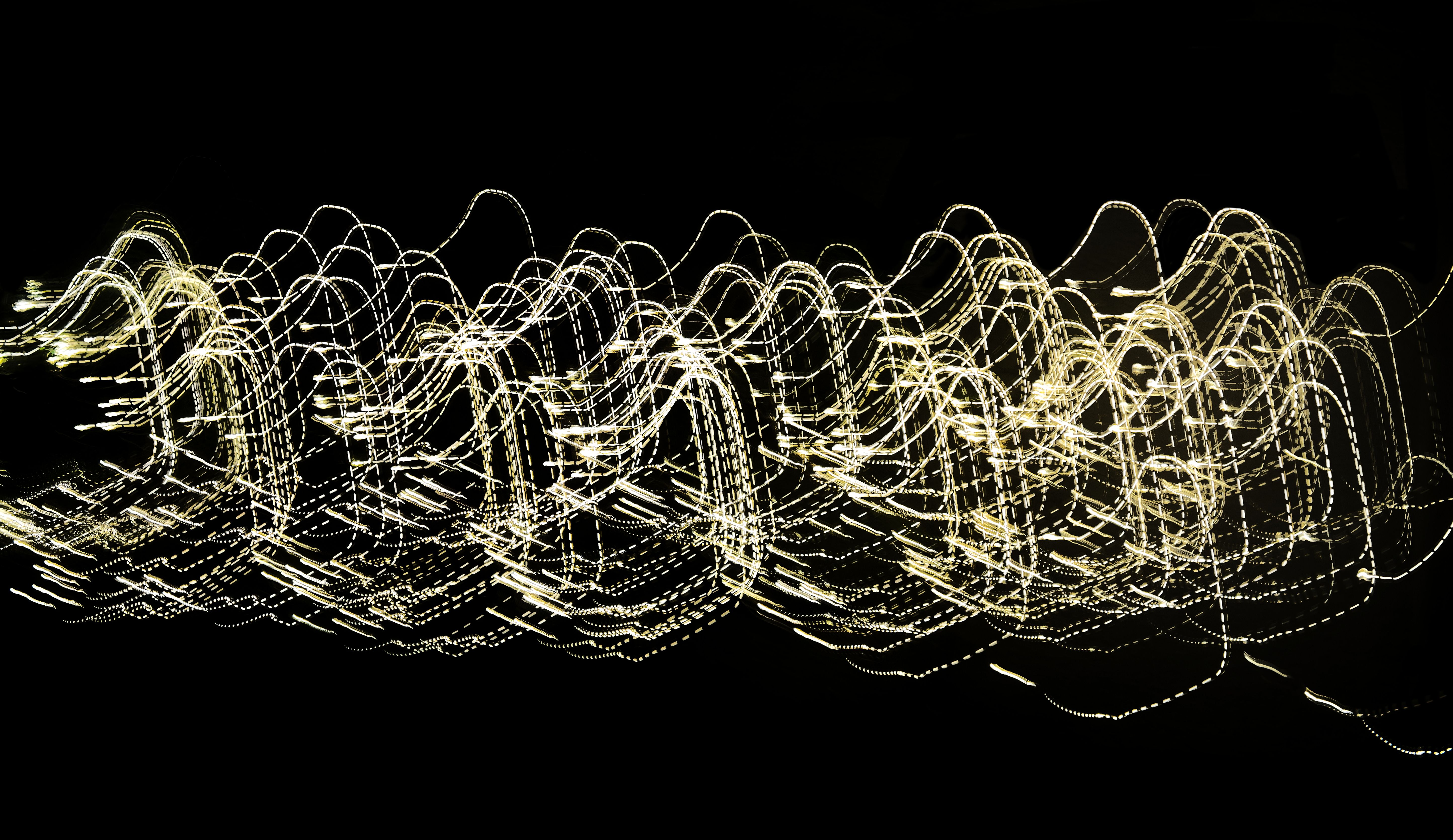 Abstract Light Trails on a Dark Background · Free Stock Photo
