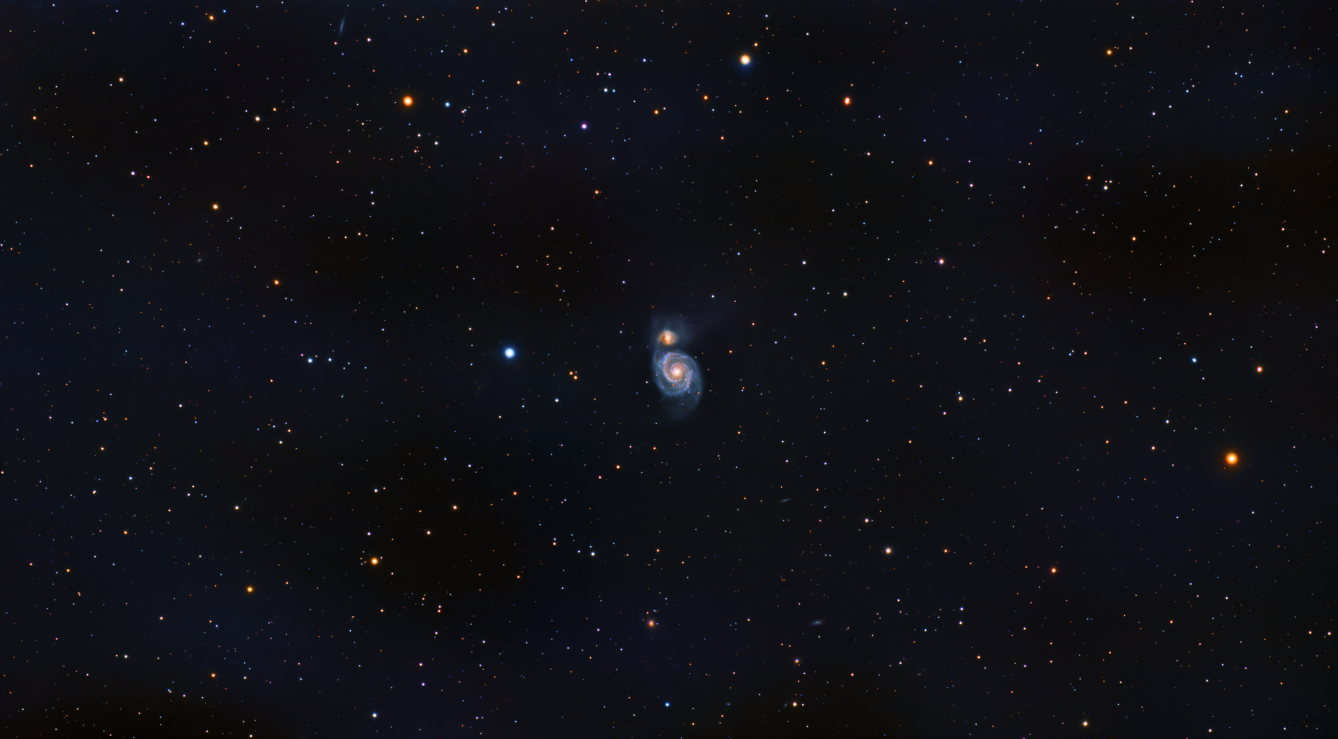 A mesmerizing view of a spiral galaxy surrounded by countless stars in deep space.