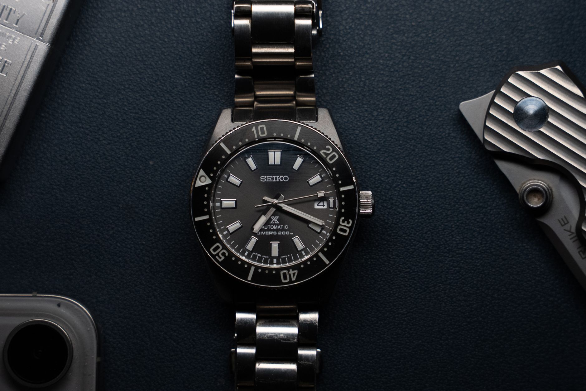 A blue dial mechanical watch close up
