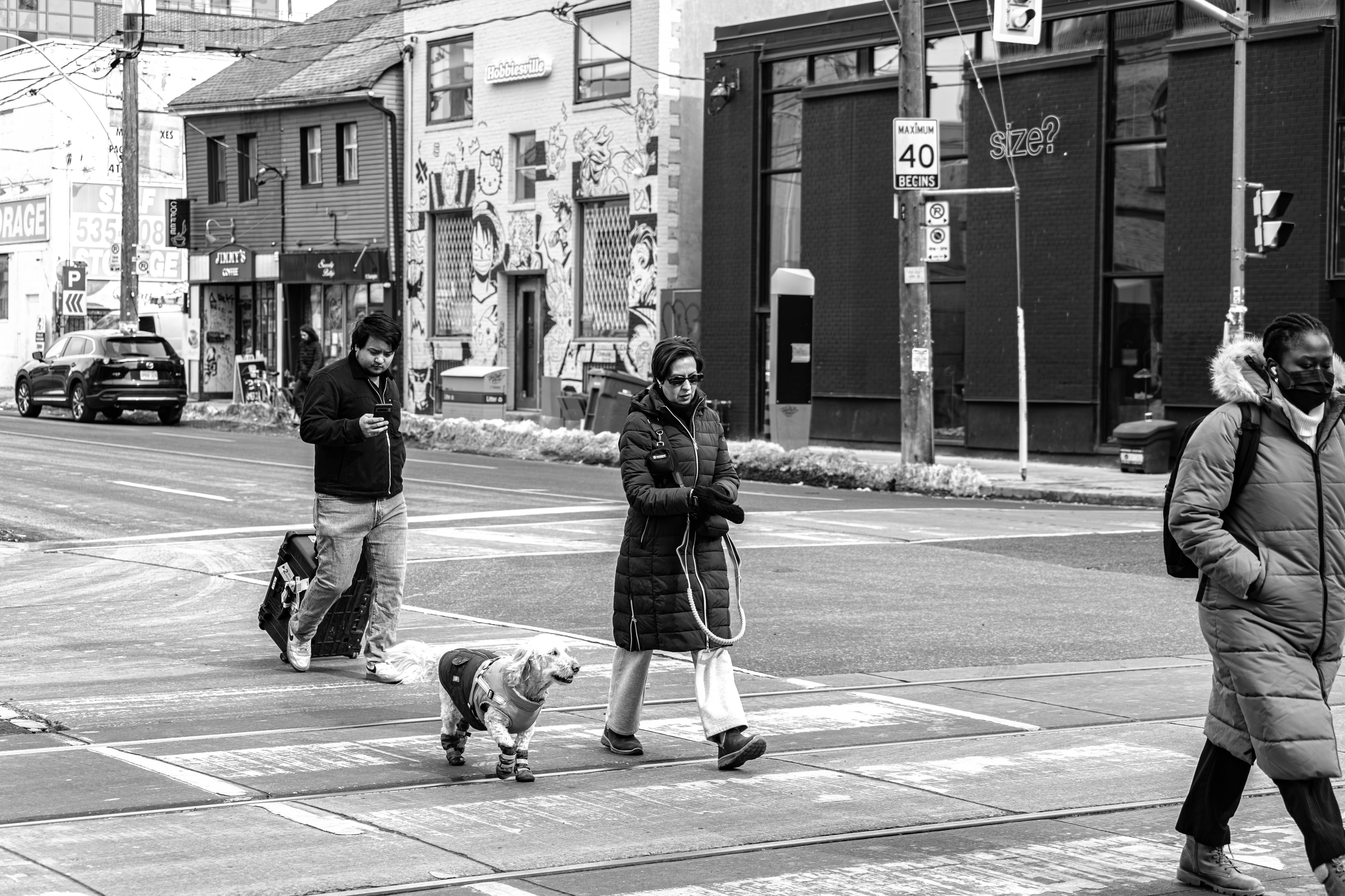 Black and White Urban Street Scene with Pedestrians · Free Stock Photo