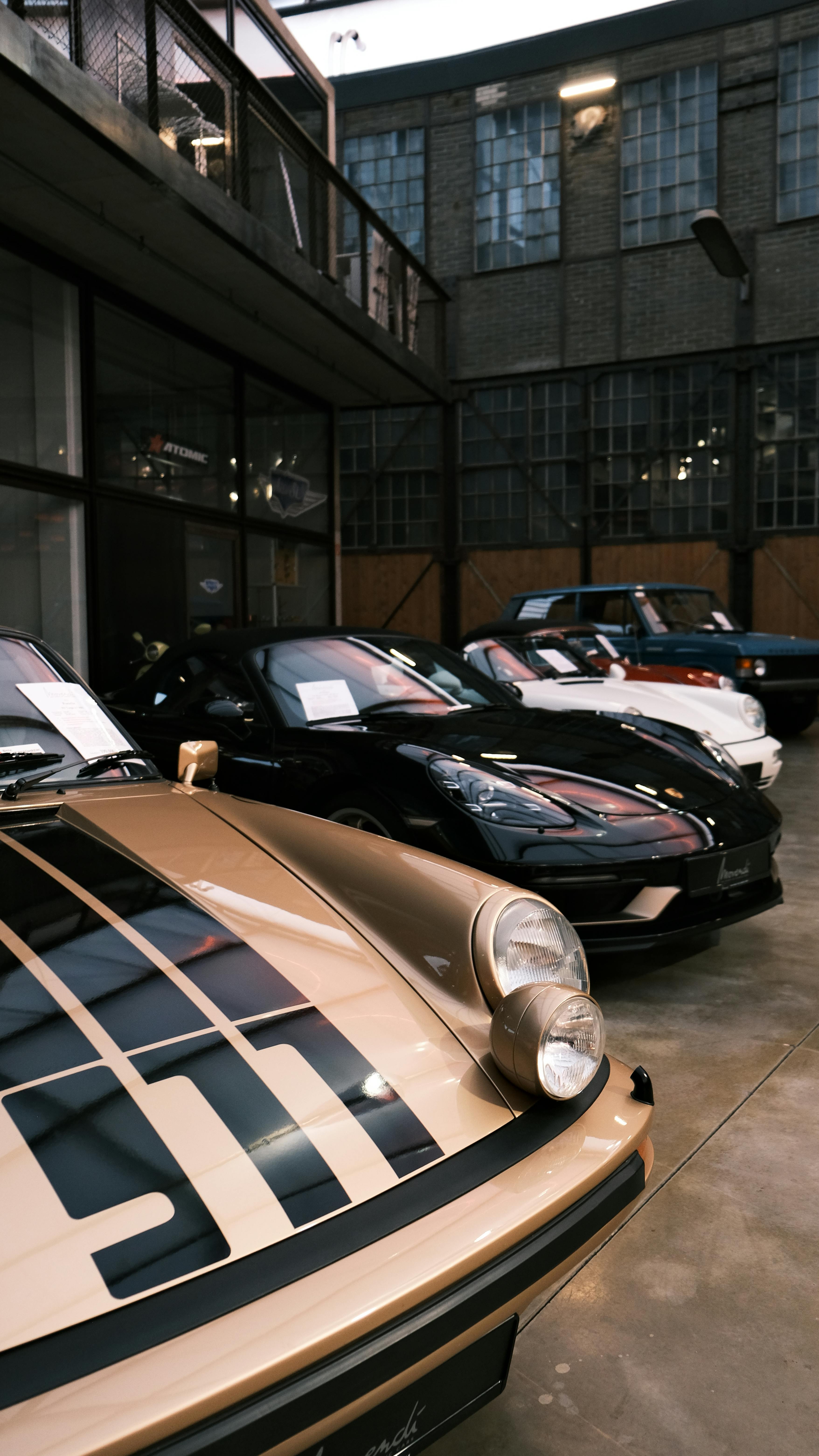Free A collection of classic cars showcased indoors at a Düsseldorf showroom, Germany. Stock Photo