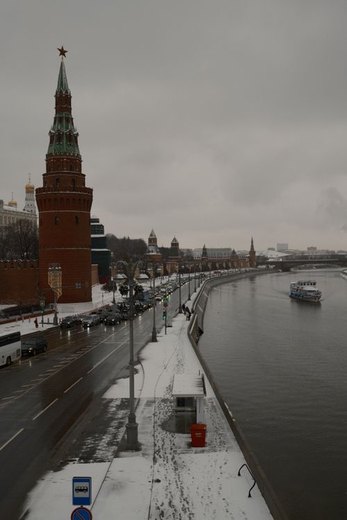 Free Winter view of the Moscow Kremlin and Moskva River with snow-covered roads and a river cruise. Stock Photo