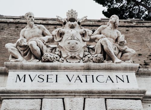 Free Statues at the entrance of the Vatican Museum, Rome, showcasing classic art and architecture. Stock Photo