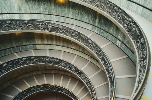Free Intricate design of the Vatican Museum's iconic spiral staircase in Rome, Italy. Stock Photo