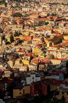 Vibrant aerial cityscape of Naples, showcasing historical architecture and bustling urban life.