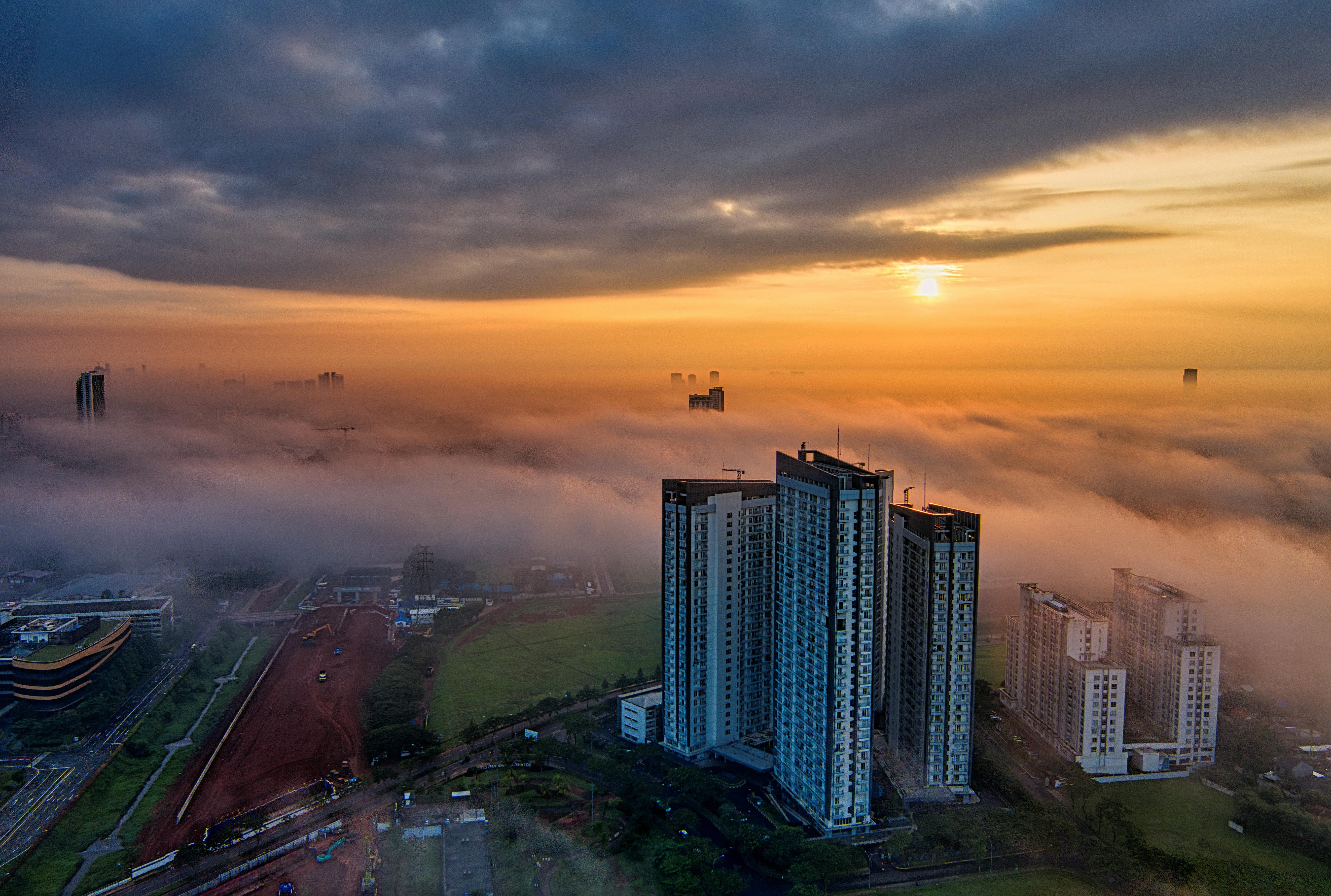 high rise buildings during sunset