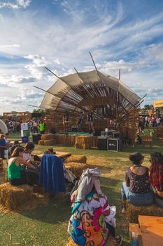 Live performance at an outdoor festival in Buenos Aires with a rustic stage design.