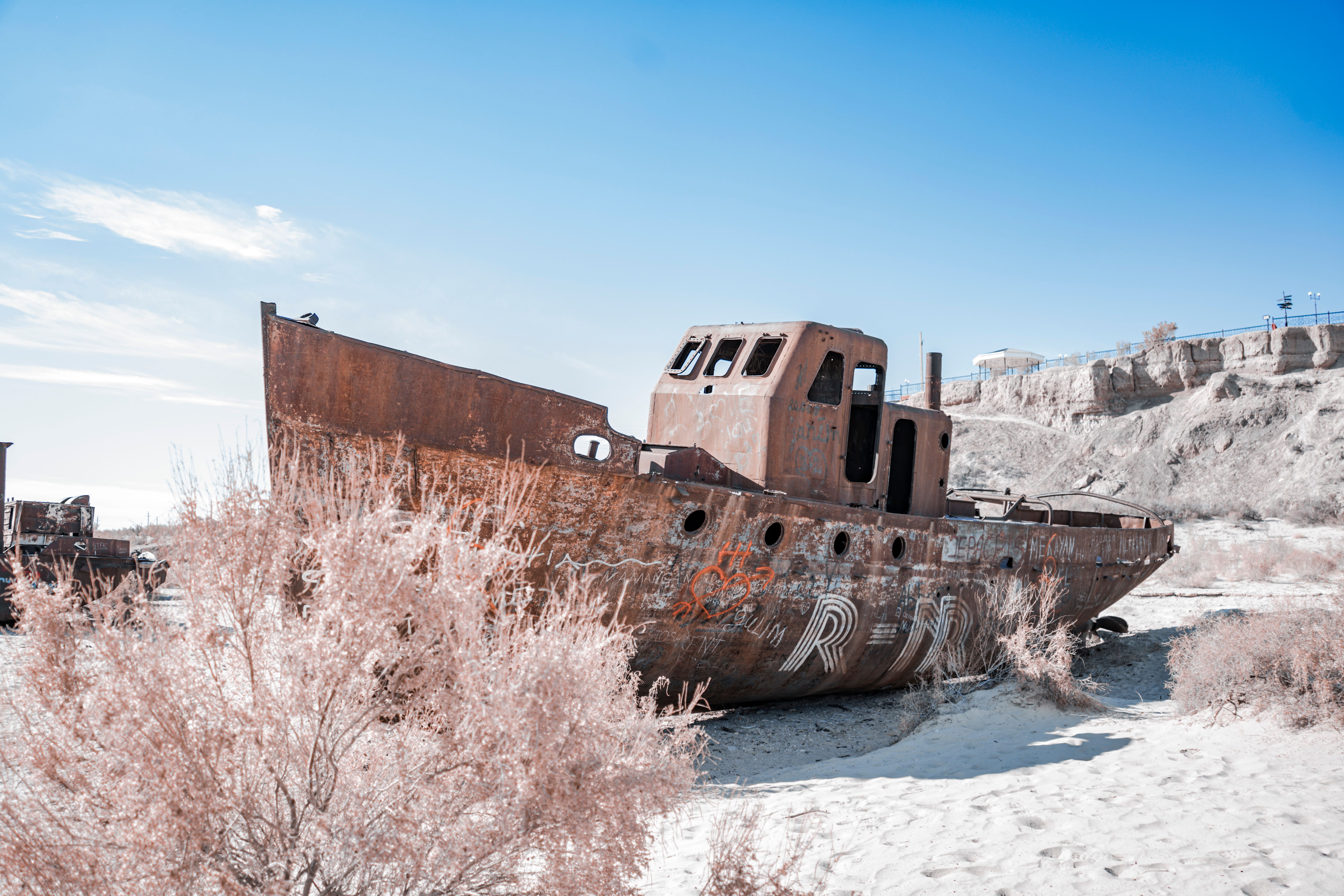 Rusty Shipwreck in Aral Sea Desert Landscape