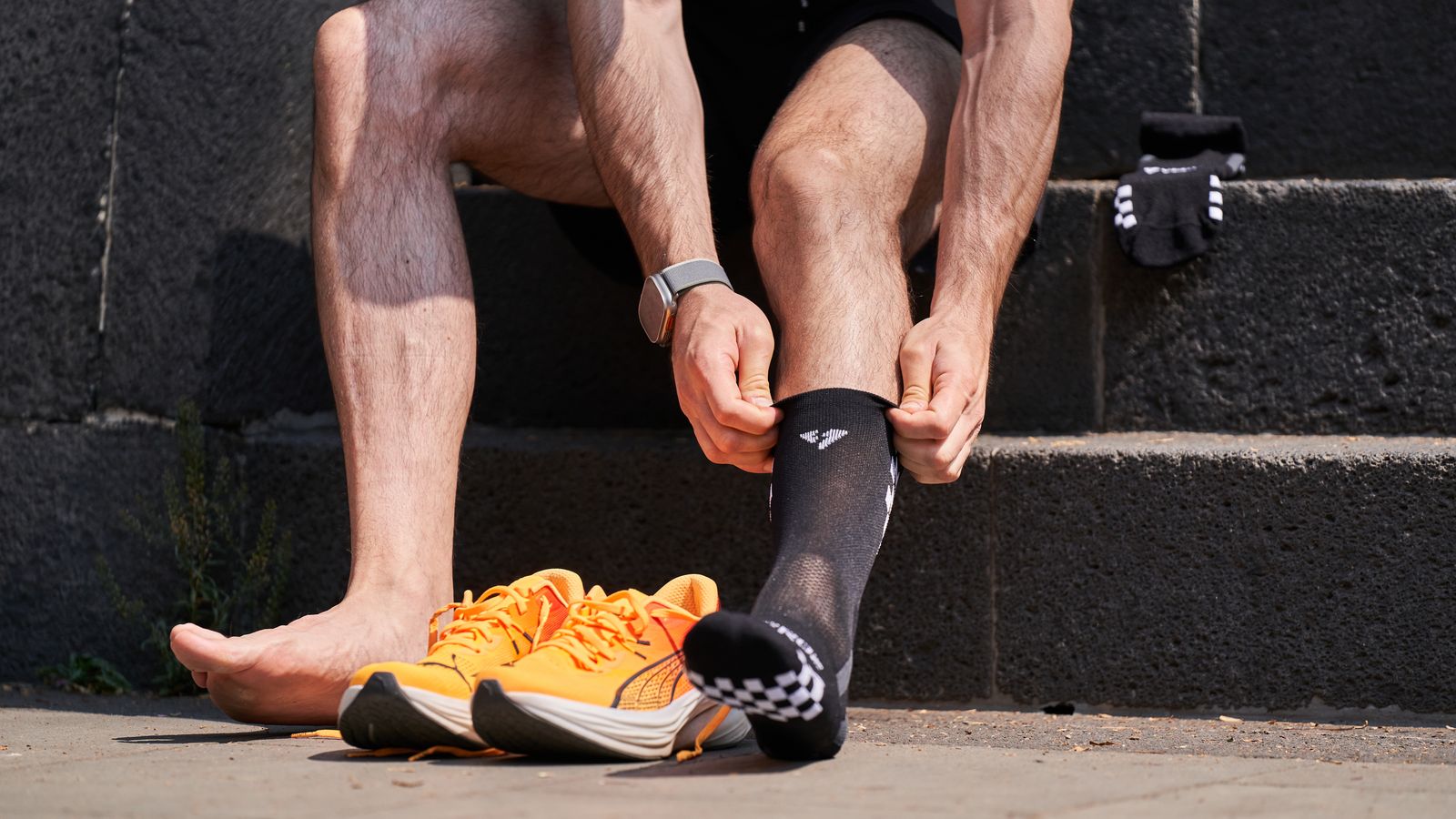 Person training in a bright gym with knee support during a controlled workout