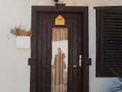 Reflection in a Glass Door of Room 1