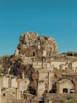 Explore the ancient rock dwellings of Matera, Italy, showcasing stunning architecture and history.
