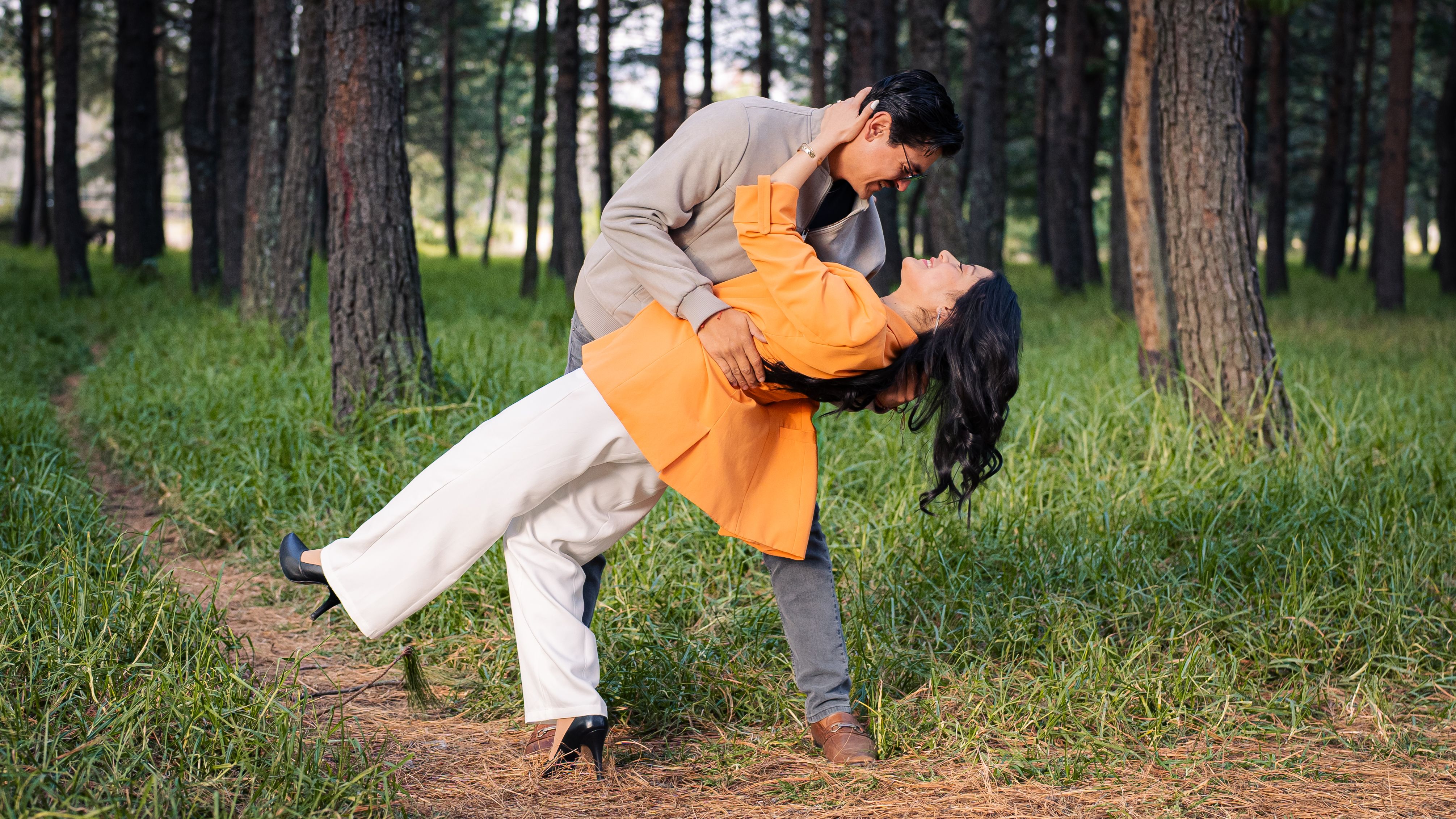 Romantic Couple Dancing in a Forest Clearing · Free Stock Photo