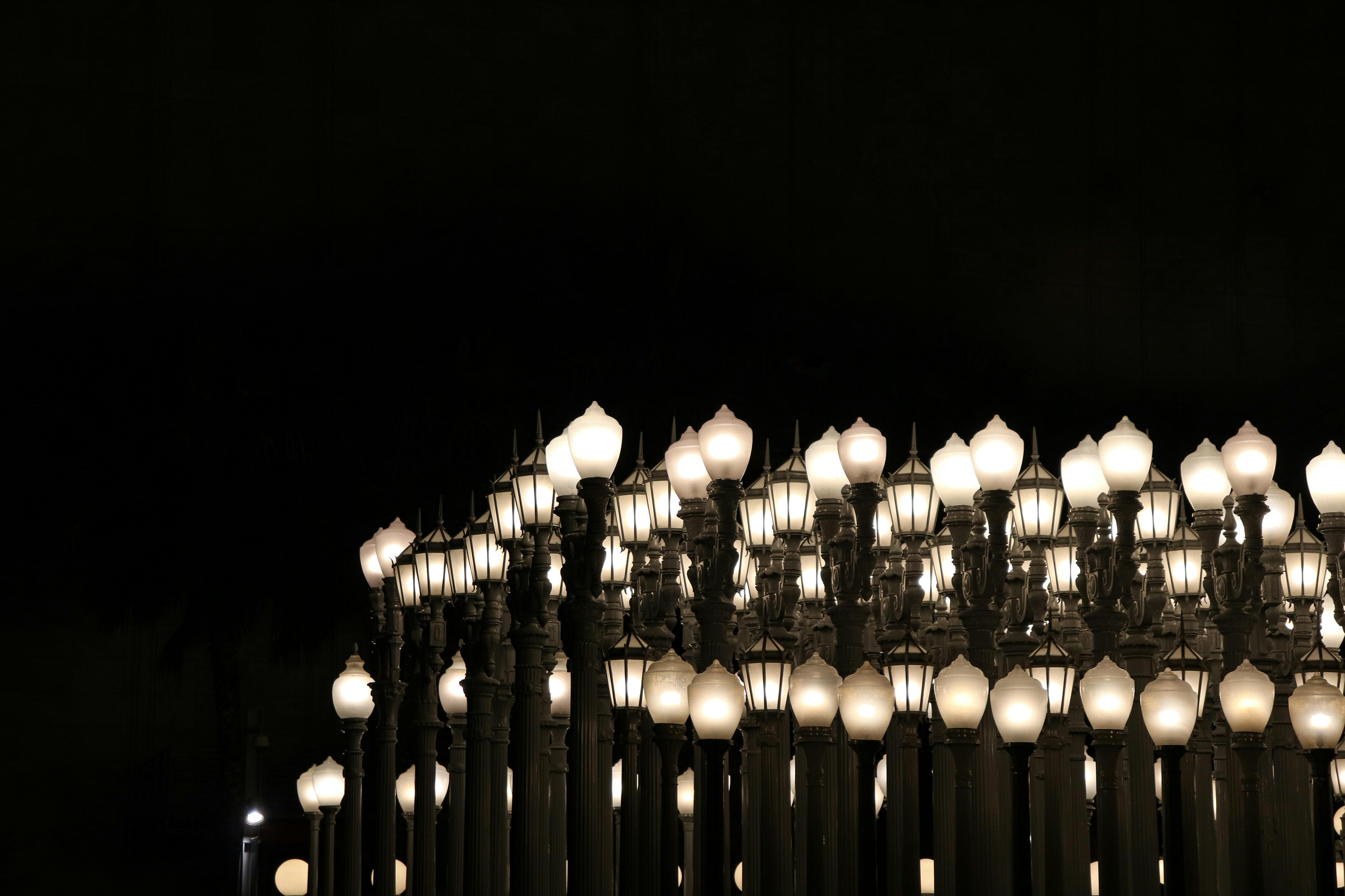 Free A series of vintage street lamps at LACMA in Los Angeles, captured at night. Stock Photo