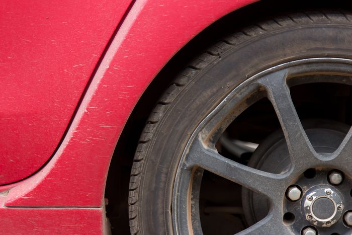 Chrome tire valve stem caps on car wheel
