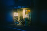 Moody Night Scene of a Japanese Street Corner Shop