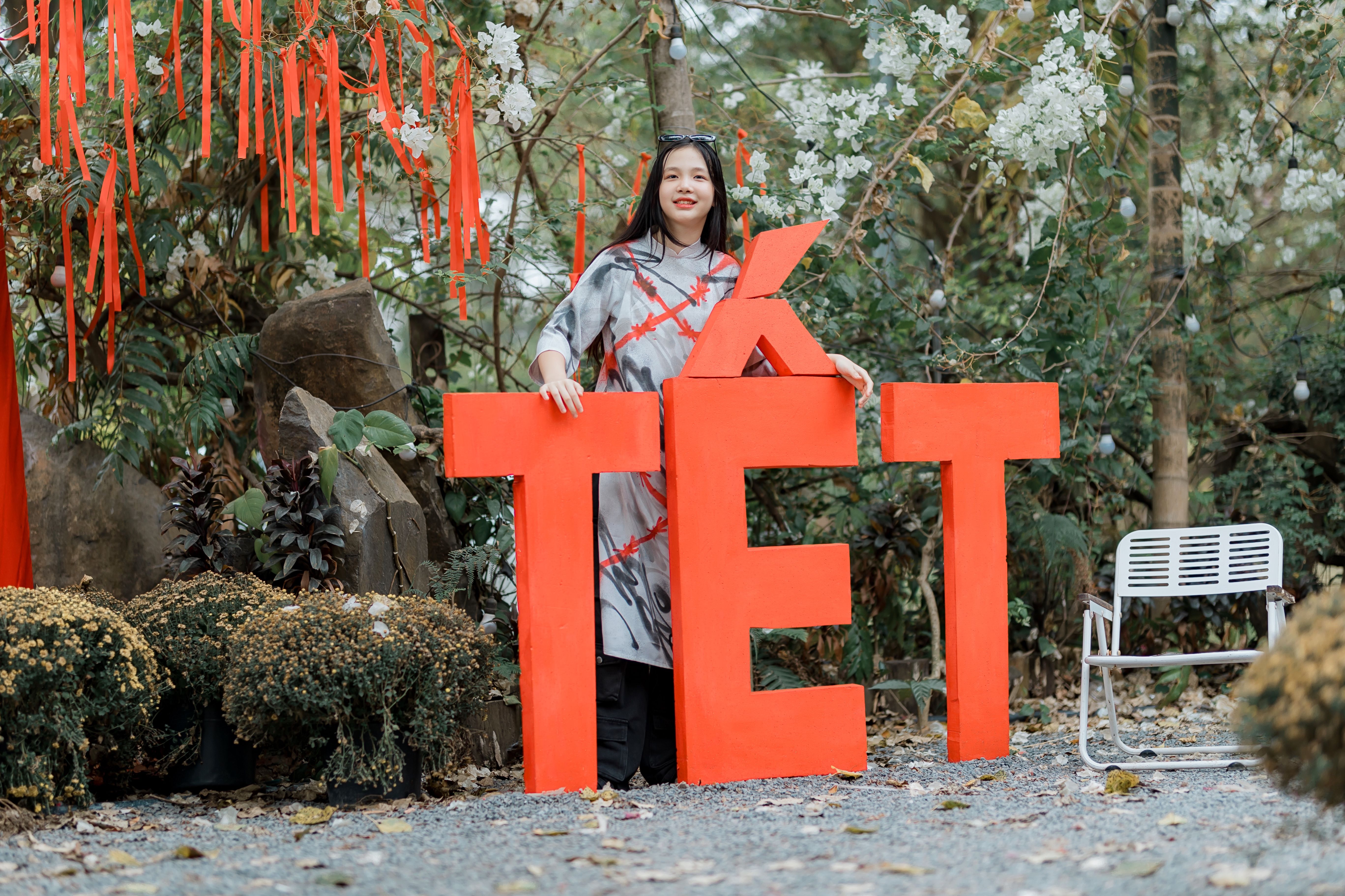 Woman Celebrating Tet in Traditional Vietnamese Garden · Free Stock Photo