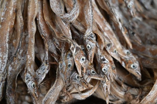 A detailed close-up of dry fish displayed in a market in Chittagong, Bangladesh.