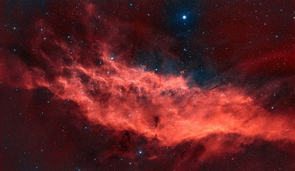 Breathtaking image of the California Nebula in vibrant red hues against a starry night sky.
