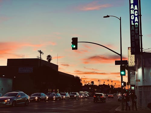 Cars on Road during Sunset