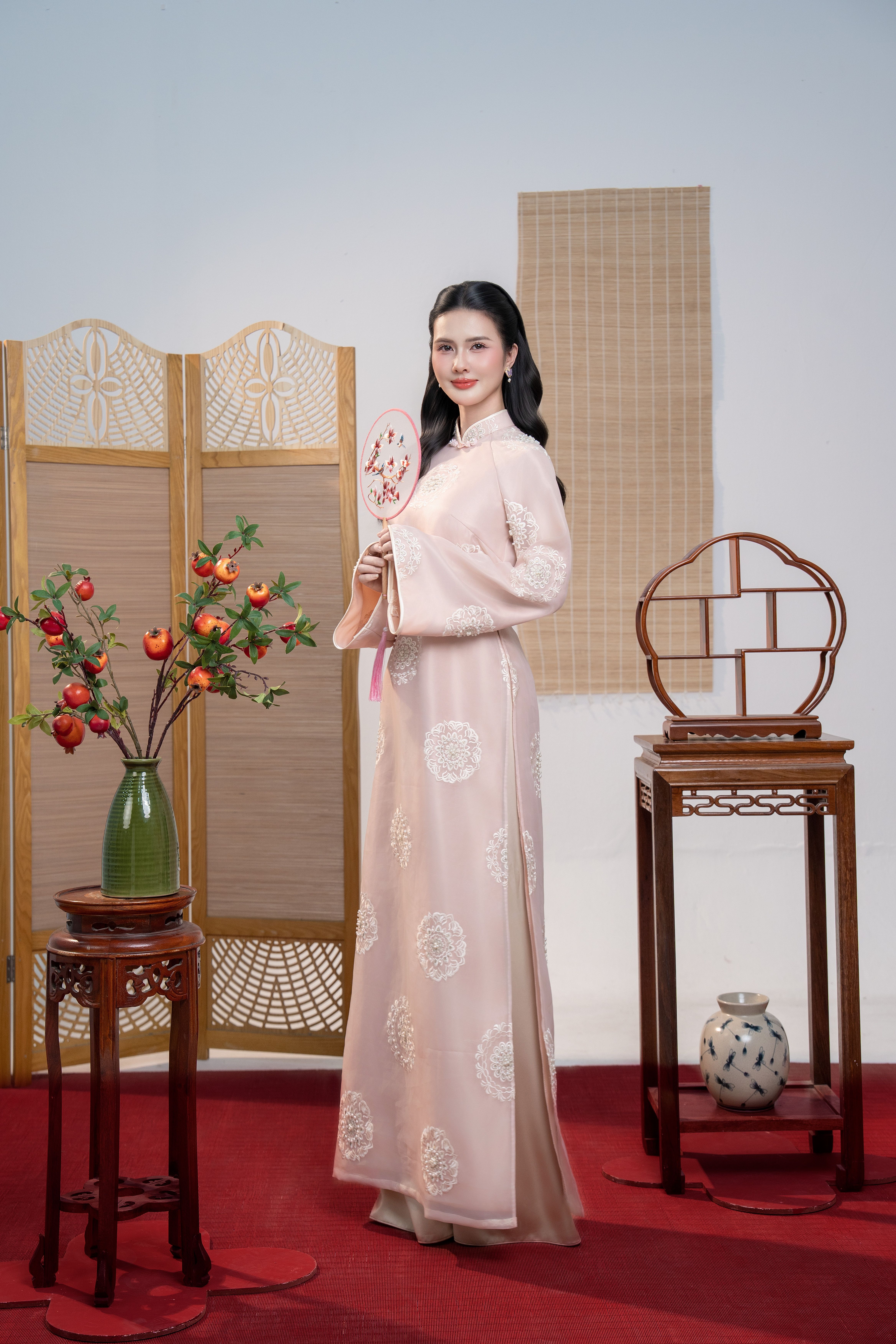 Elegant Woman in Traditional Asian Attire Indoors · Free Stock Photo
