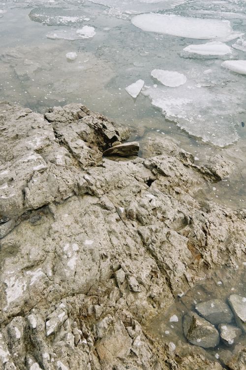 Free Rocky shoreline with ice formations at Konaev, Kazakhstan. Stock Photo