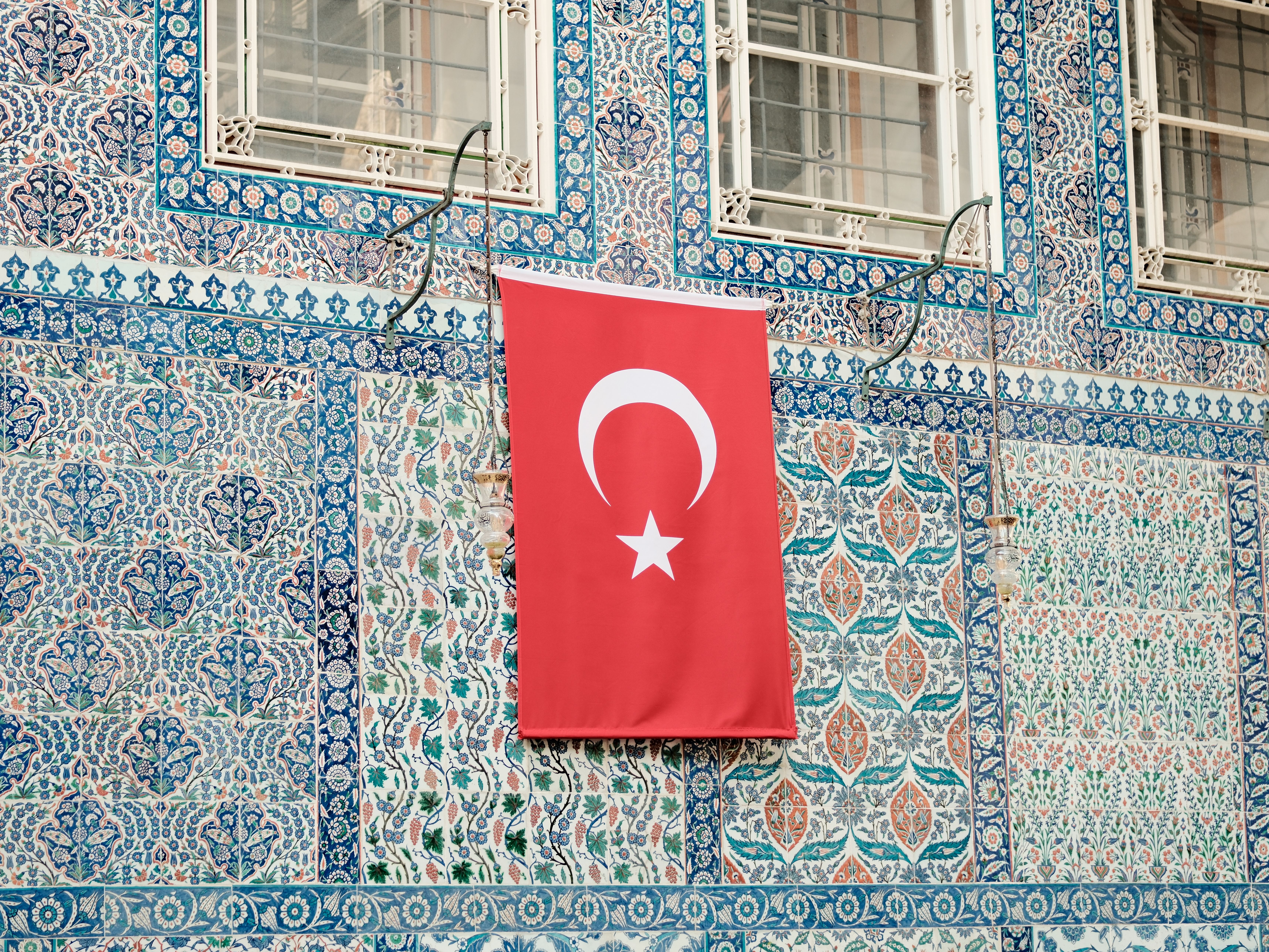 The Turkish flag displayed on a beautifully tiled wall exemplifies Istanbul's rich cultural heritage.