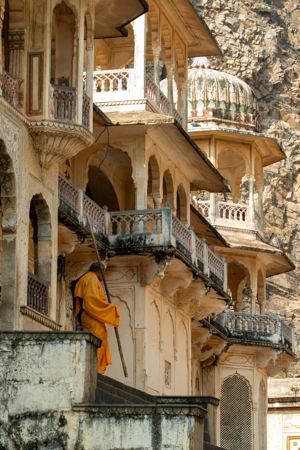Historic Indian Architecture with Monk in Orange Robe · Free Stock Photo