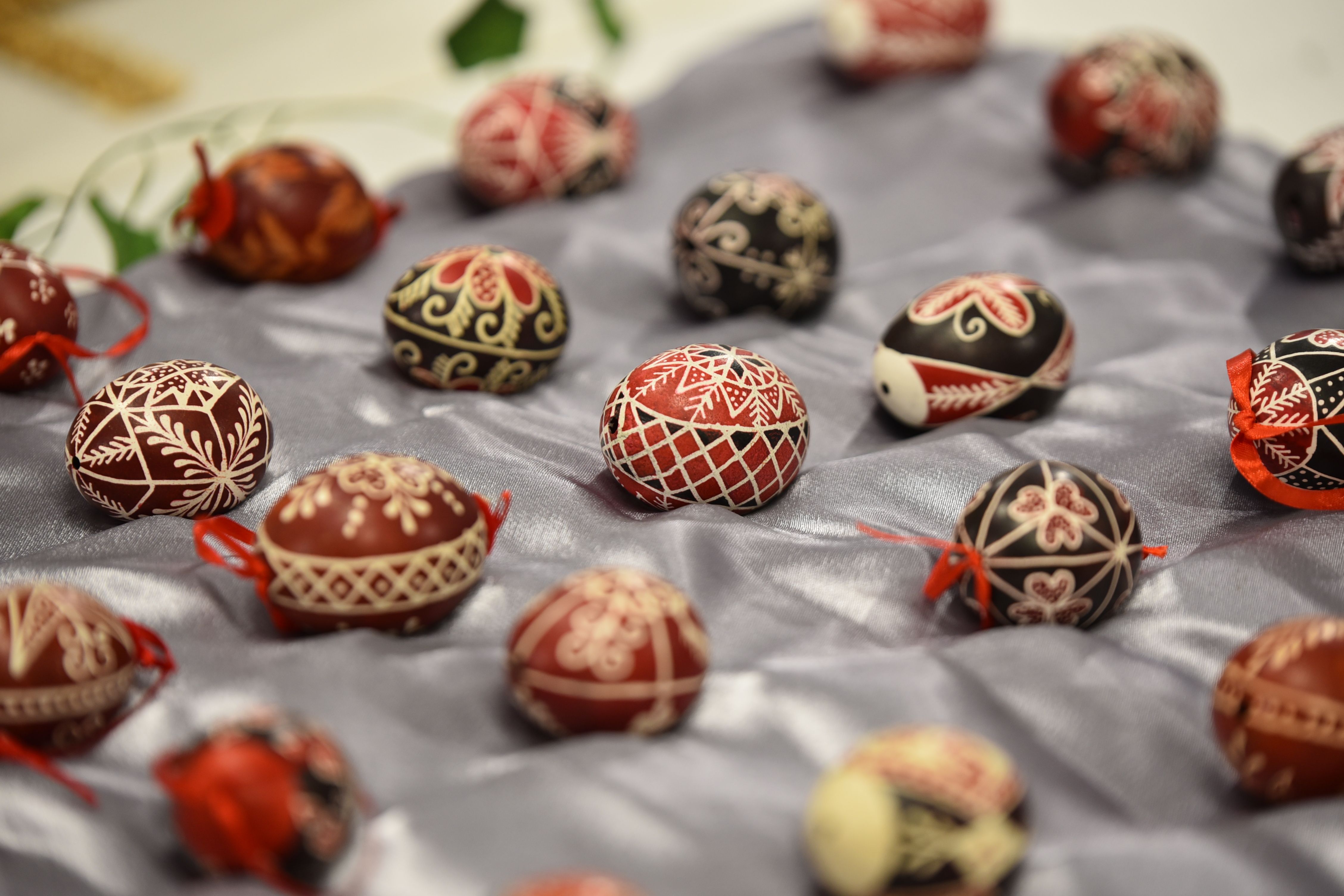 Beautiful handcrafted Hungarian Easter eggs with intricate designs on display.