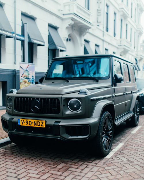 Mercedes-Benz G-Class Parked on the Side of a Street in a City · Free ...