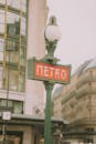 Vintage Paris Metro Sign on a Cloudy Day