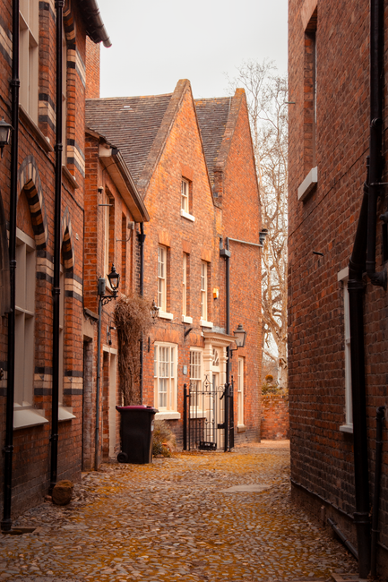 Explore a quaint, historic cobbled street in Shrewsbury, England's tudor-style architecture.