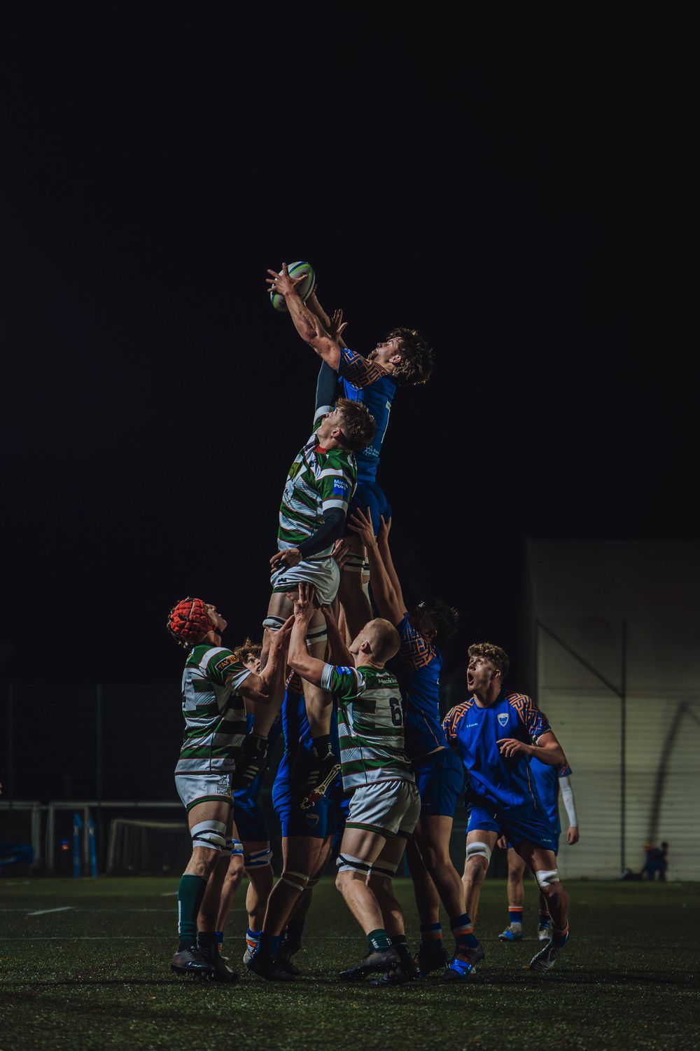 Lineout at night under floodlights