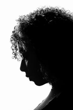 Artistic black and white silhouette of a woman with curly hair. Perfect for dramatic and creative projects.