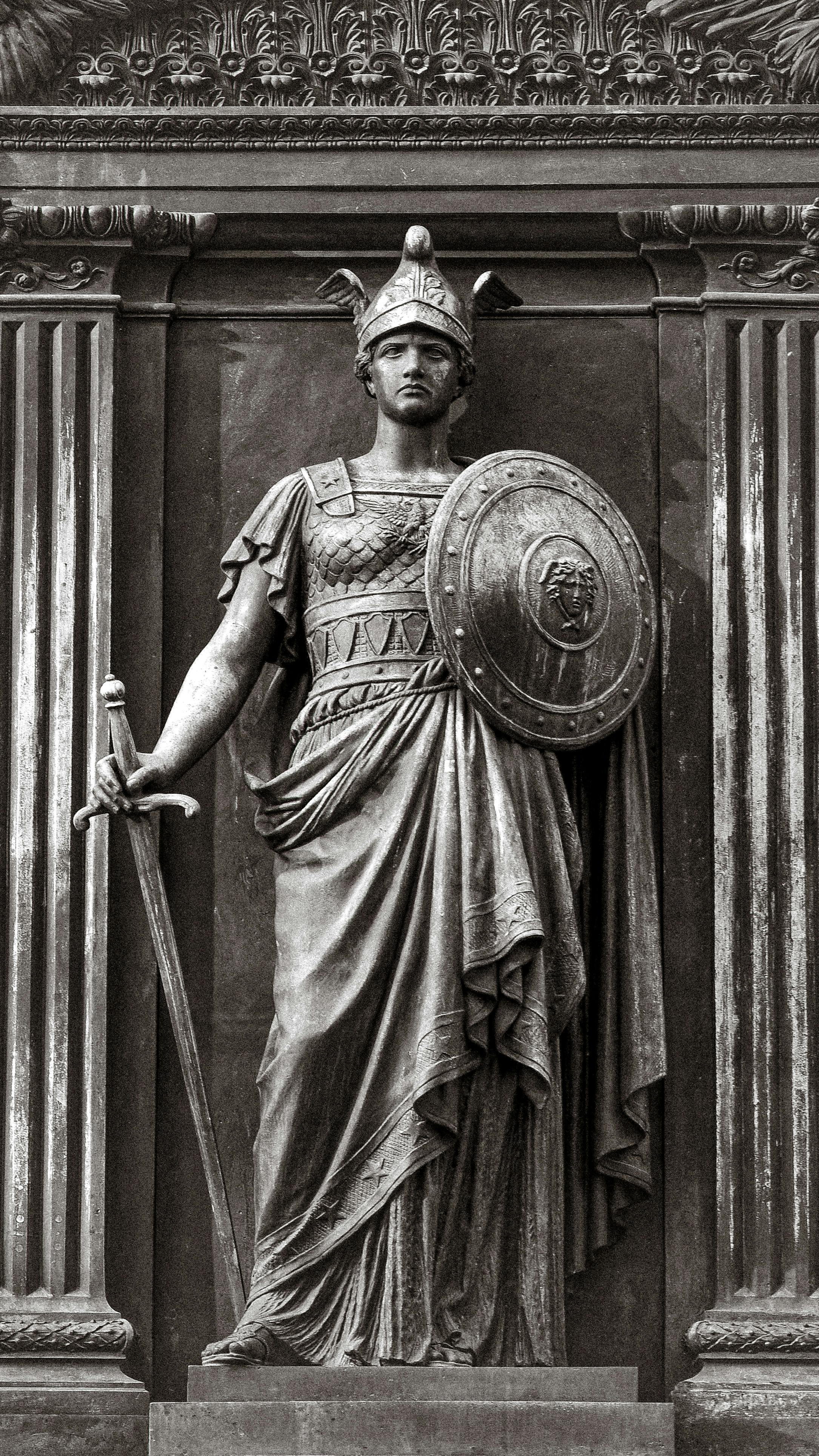 Monochrome statue of a Roman warrior holding sword and shield, Washington, DC.