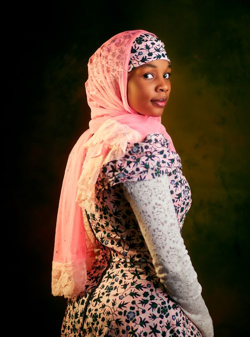 Portrait of a Woman in Traditional Pink Headscarf · Free Stock Photo