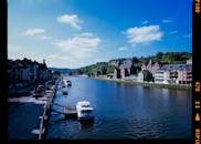 Scenic River View with Boats and Buildings